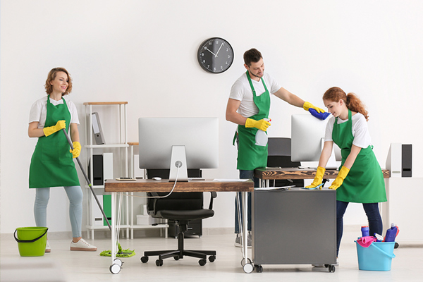 Commercial cleaning team in office